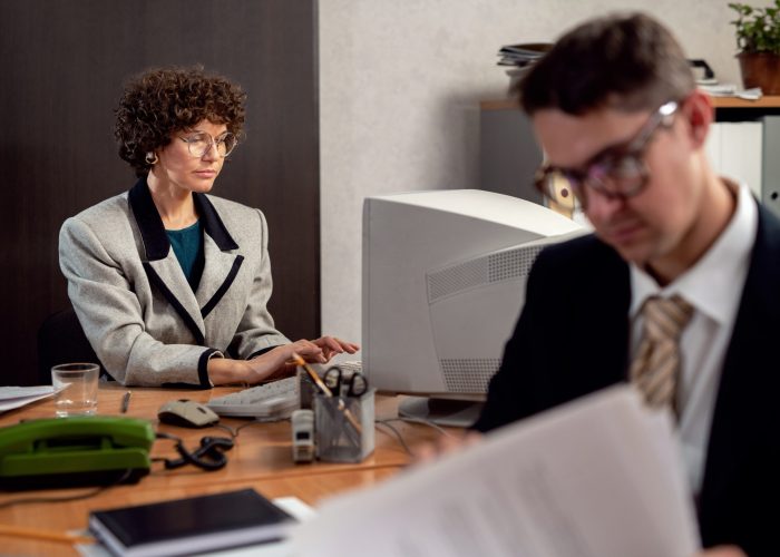 vintage-style-people-working-office-with-computers